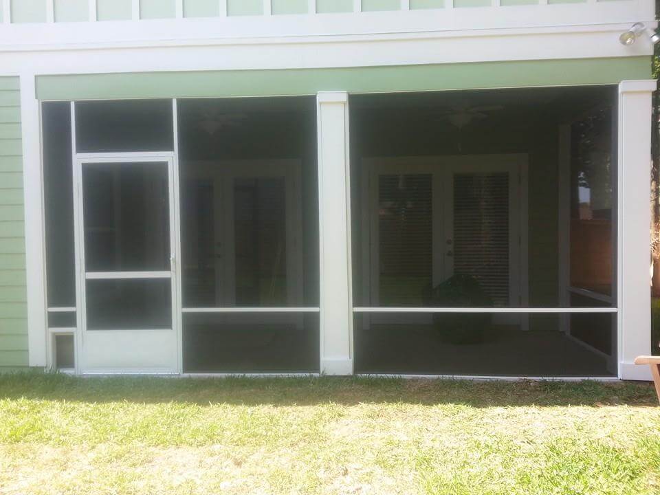 Newly screened porch on light green house near Jacksonville, FL